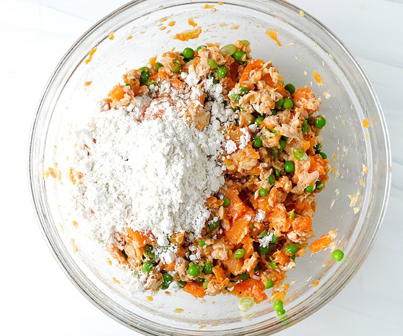 Adding flour to fish cakes