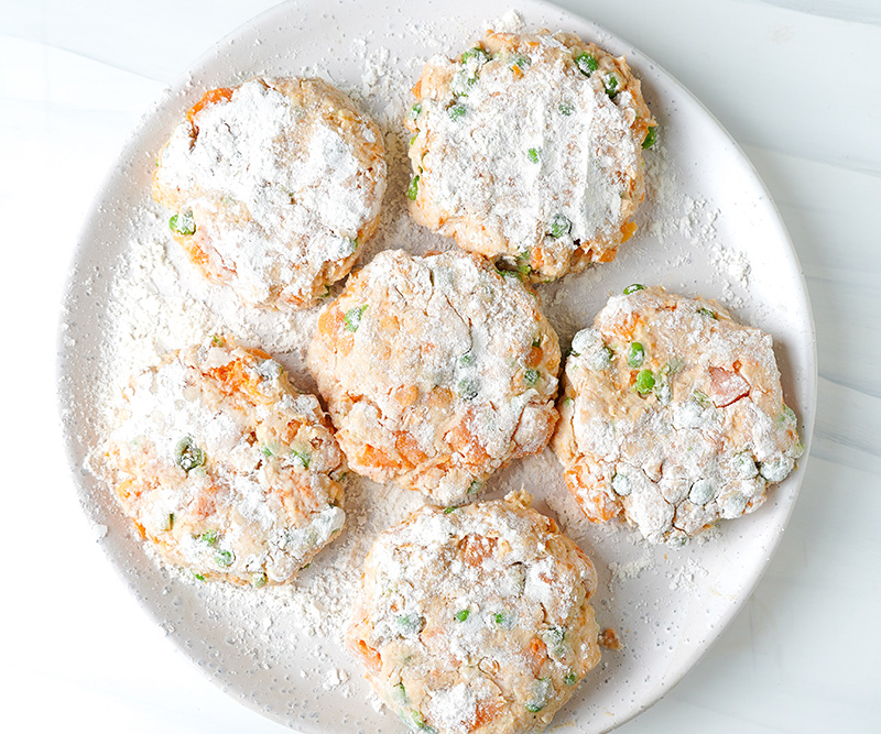 Make salmon fish cake patties and dust with flour