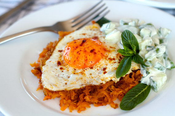 Healthy Breakfast of Sweet Potato Rosti With Fried Egg & Cucumber Tahini Raita