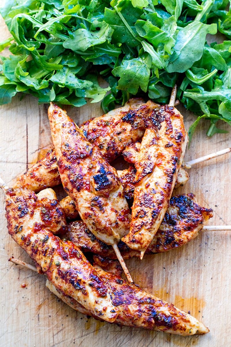 Pan Fried Chicken Tenders With Marjoram Marinade & Arugula Salad on the board