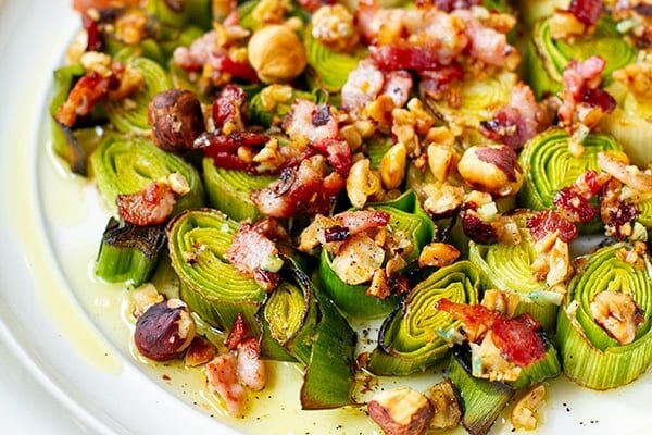 Roasted leeks with bacon and hazelnut dressing