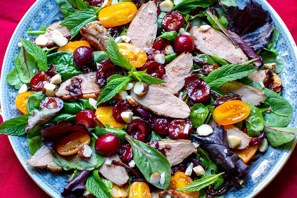 Warm duck salad with balsamic cherries and mint