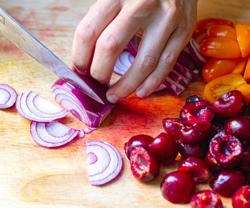 Slice onions and tomatoes for the salad