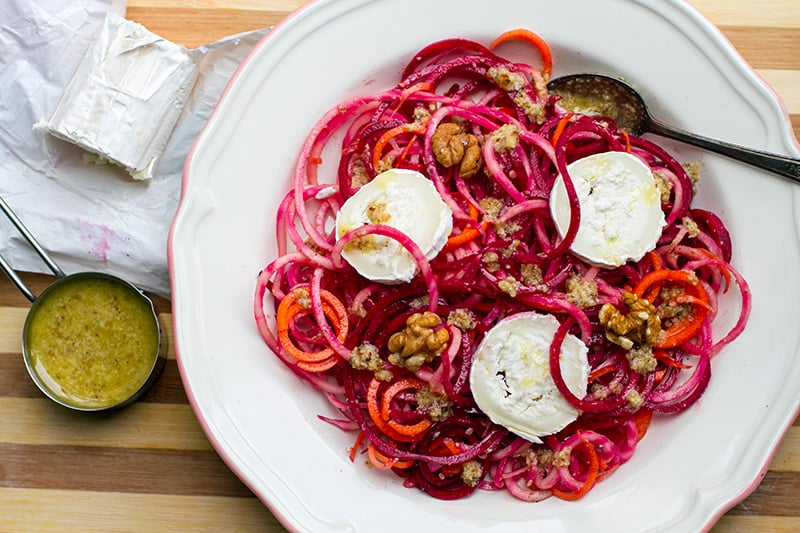 Raw beetroot salad with carrots goat's cheese and walnuts