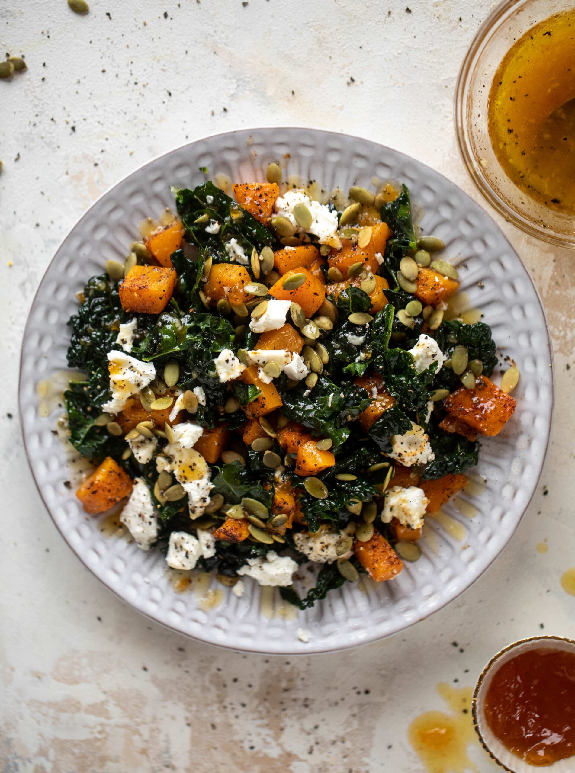 SMOKY BUTTERNUT KALE SALAD WITH GOAT CHEESE AND APRICOT VINAIGRETTE.