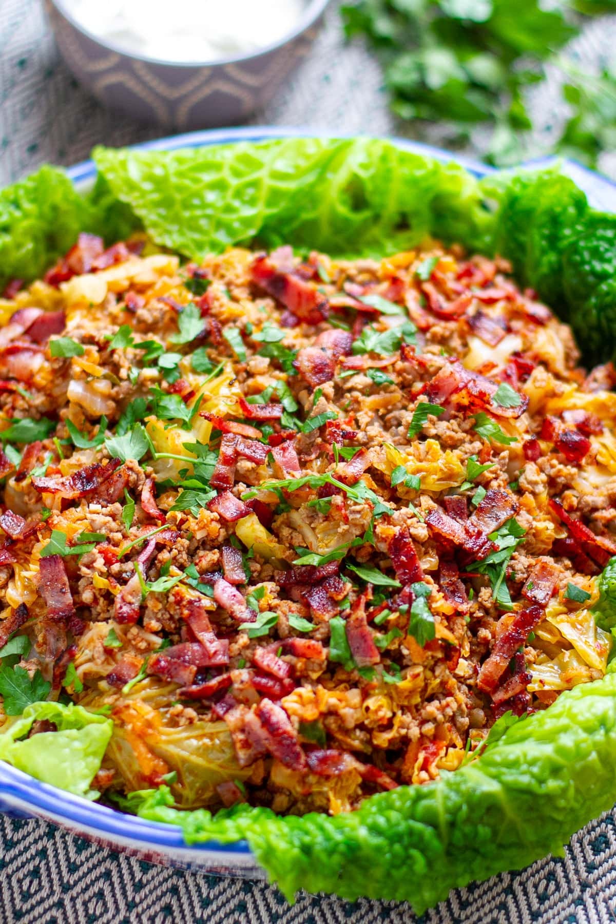 Cabbage and beef casserole with crispy bacon.