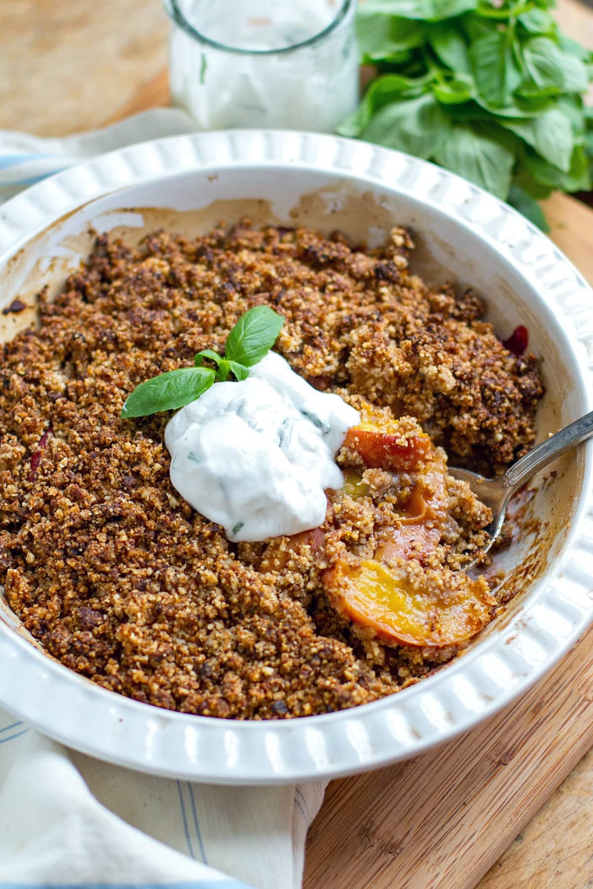 Paleo peach crisp with basil cream