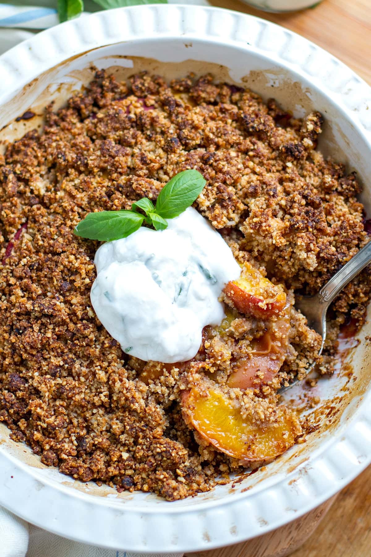 Paleo peach crisp with basil yogurt