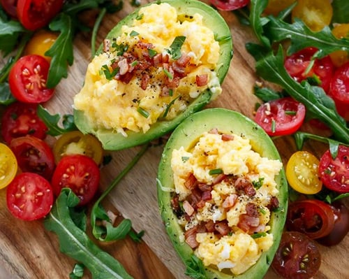 Scrambled eggs and bacon stuffed avocados