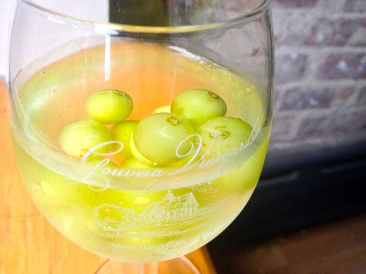 White wine spritzer with frozen grapes