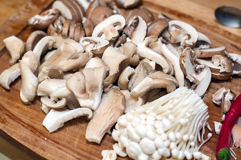 Different types of mushrooms: Swiss brown, oyster and enoki