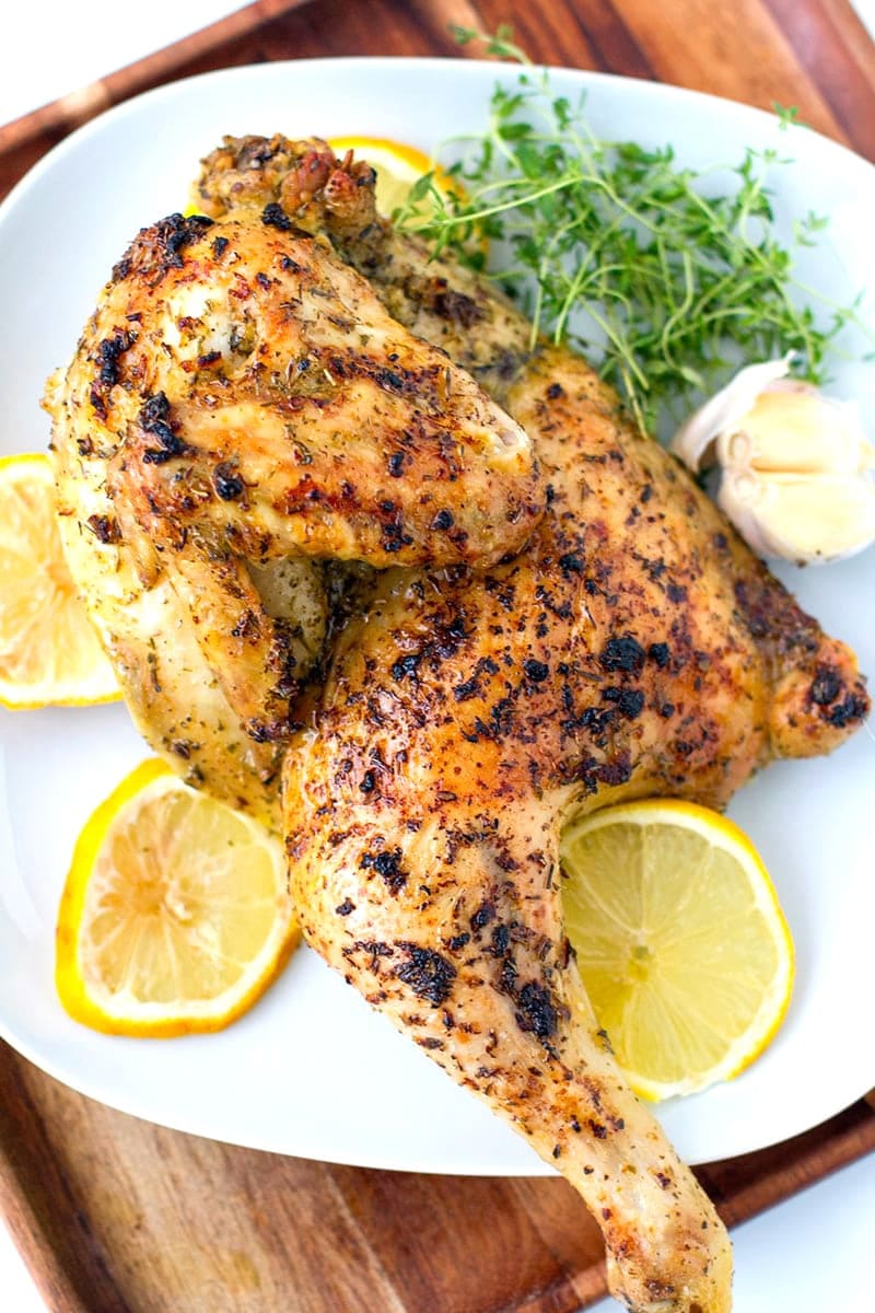 https://www.cookedandloved.com/wp-content/uploads/2018/08/greek-roast-chicken-lemon-garlic-new-2.jpg