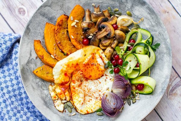 Turmeric fried egg with roasted squash and mushrooms