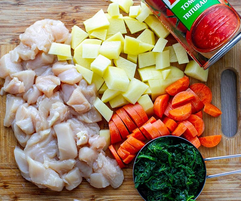 Chicken, potatoes, carrots, spinach, tomatoes