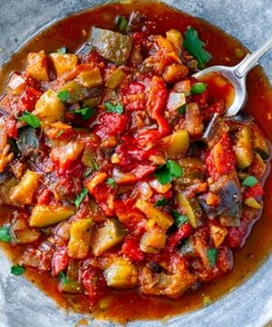 Spanish pisto vegetable stew with eggplant, zucchini, tomatoes and lots of olive oil