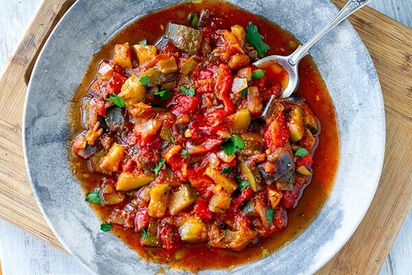 Spanish pisto vegetable stew with eggplant, zucchini, tomatoes and lots of olive oil