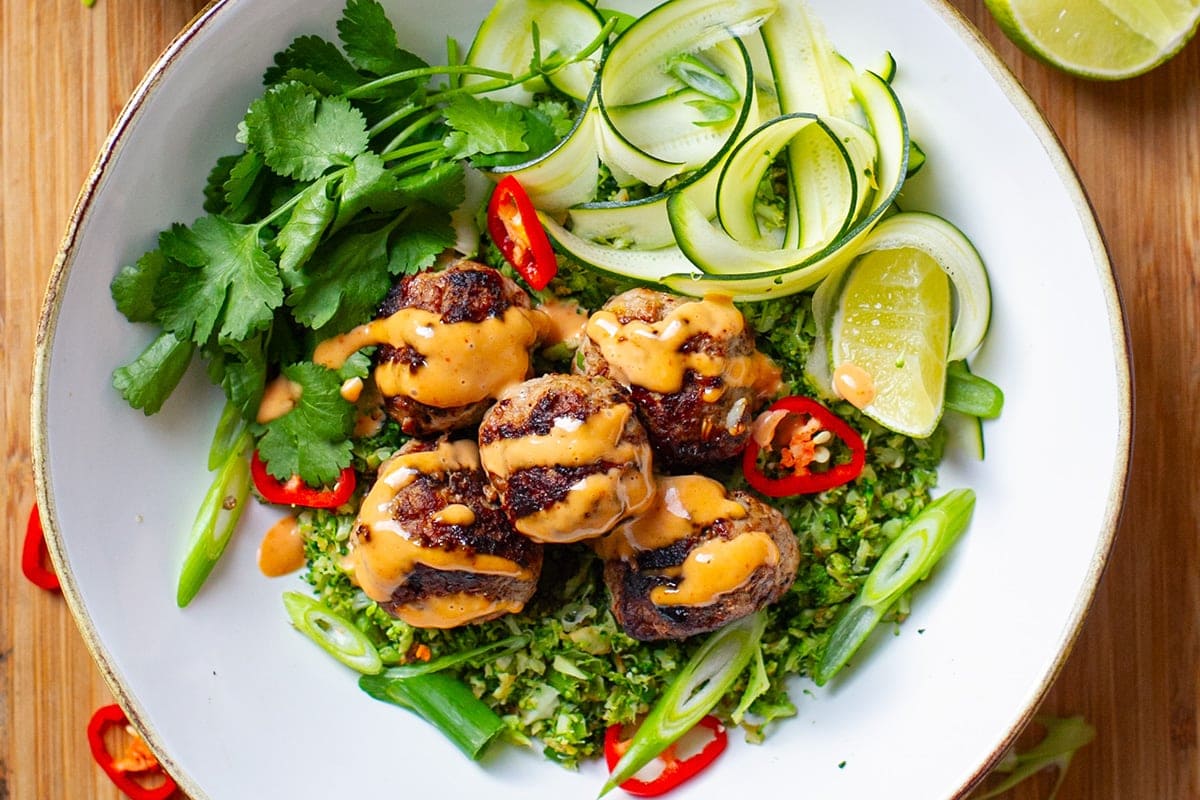 Vietnamese  pork meatballs on a bed of broccoli rice with Sriracha mayo, keto, low-carb, paleo.