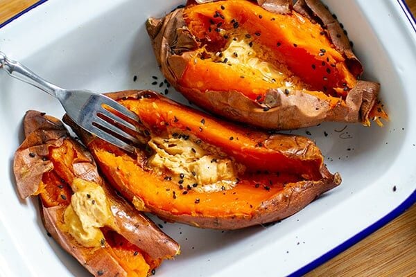 Whole Baked Sweet Potatoes With Miso Butter & Sesame Seeds