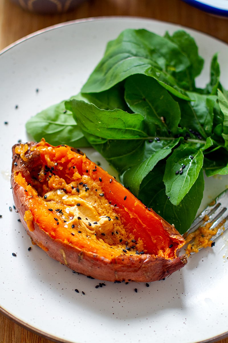 Baked sweet potato with miso butter and arugula salad