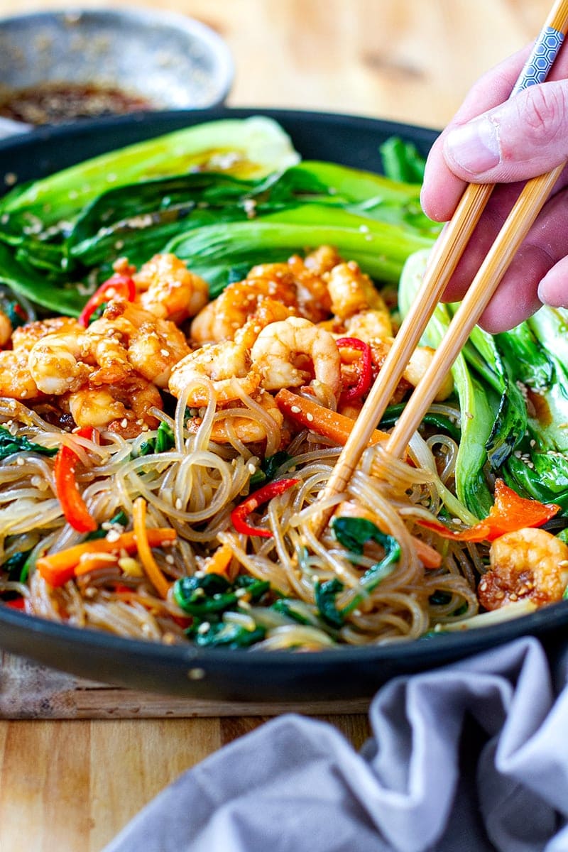 Glass noodle stir-fry with spinach, carrots, peppers and sesame sauce - Japchae