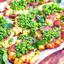 Crispy smashed potatoes with salsa verde peas