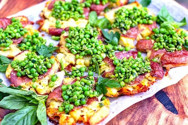 Crispy smashed potatoes with salsa verde peas