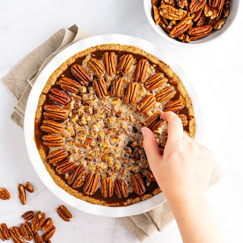 Pecan pie crust with pumpkin filling underneath