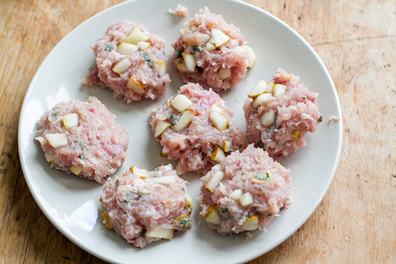 Making breakfast chicken sausage rissoles.