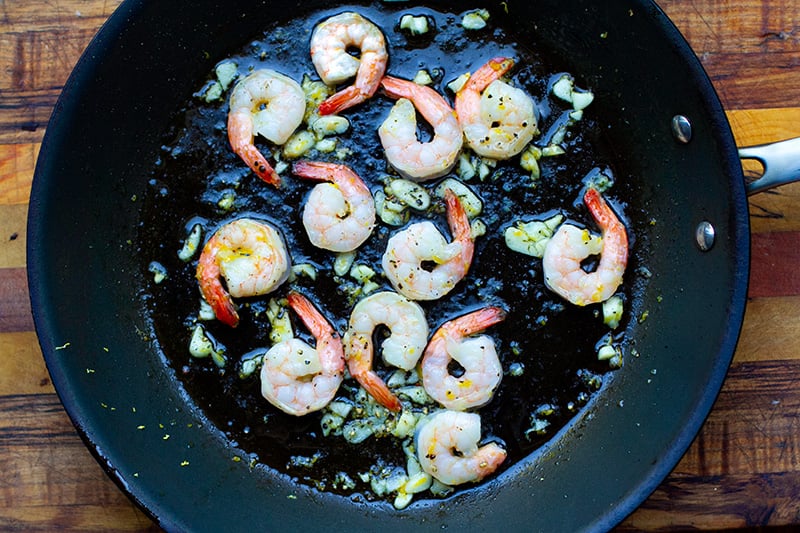 Lemon garlic shrimp in a frying pan with olive oil