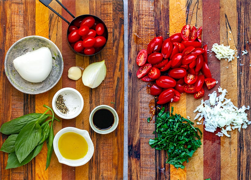 Mozzarella salad ingredients: tomatoes, onion, balsamic, garlic, basil, fresh mozzarella