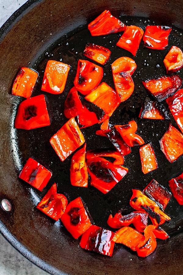 Grilled red peppers in a frying pan