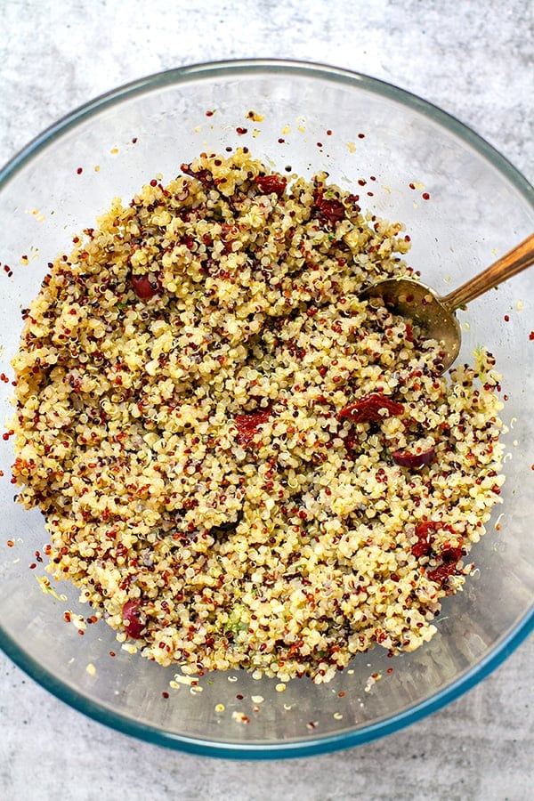 Mixing the quinoa salad