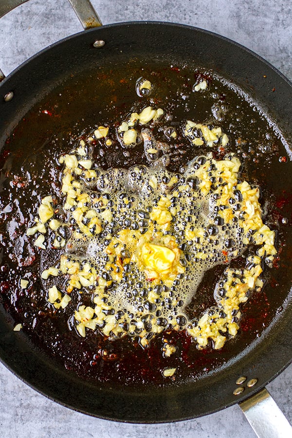 Saute ginger and garlic in a skillet with butter and oil