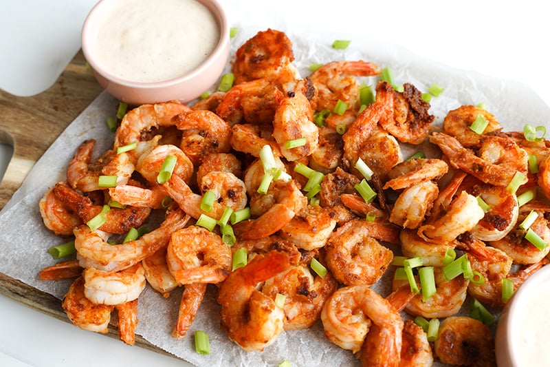 Spiced Grilled Shrimp With White BBQ Sauce On A Board