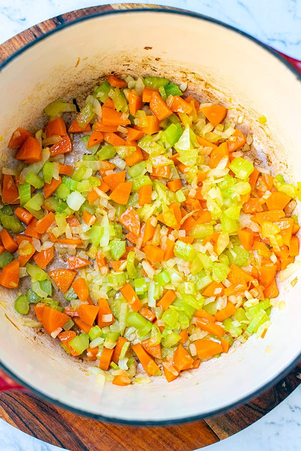 Saute the vegetables for chicken soup