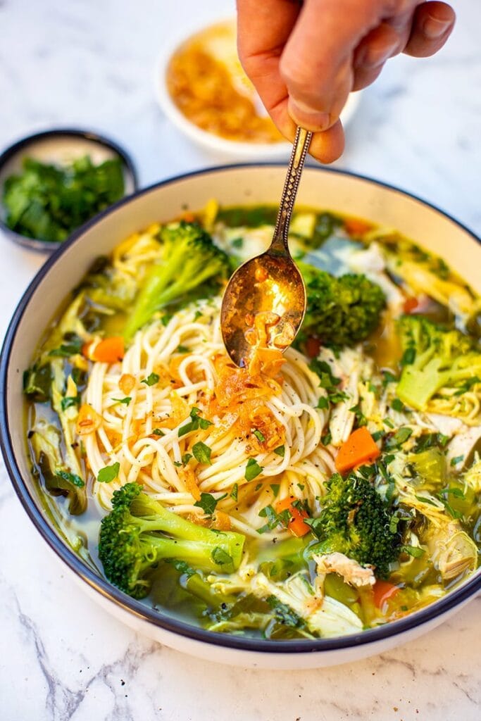 Noodles and chicken soup with garlic oil