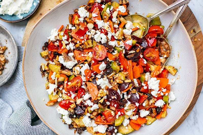 Crunchy salad with walnuts, beets, feta and raisins all finished