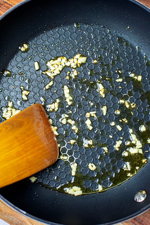 Frying garlic in a pan