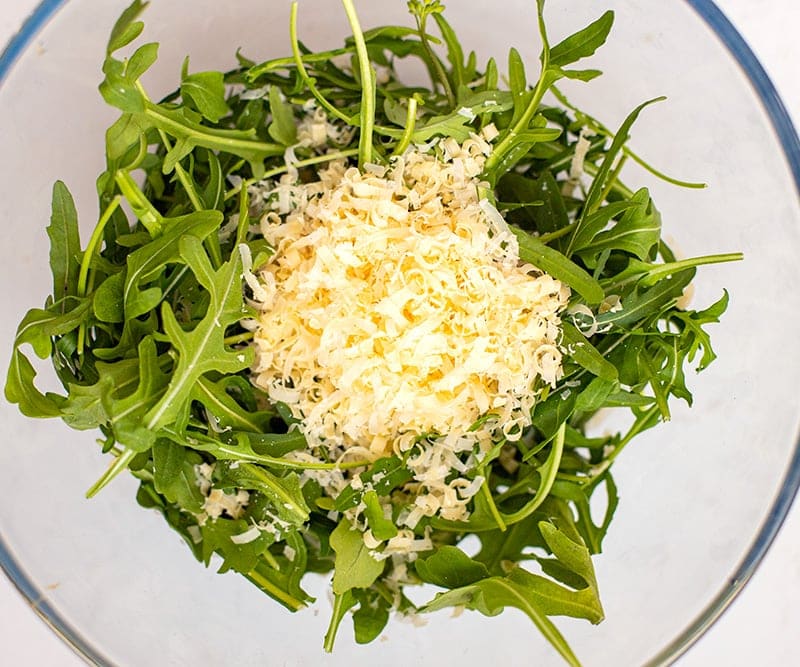 Shaved Parmesan rocket salad in a bowl