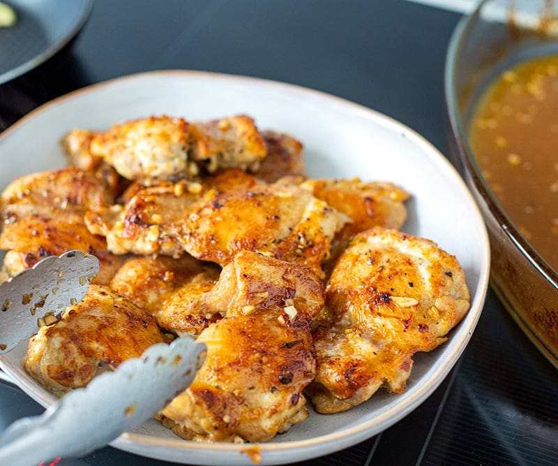 Cooked chicken thighs out of the oven