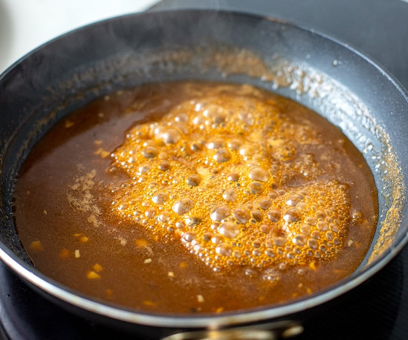 Honey garlic lemon sauce in a pan reduced