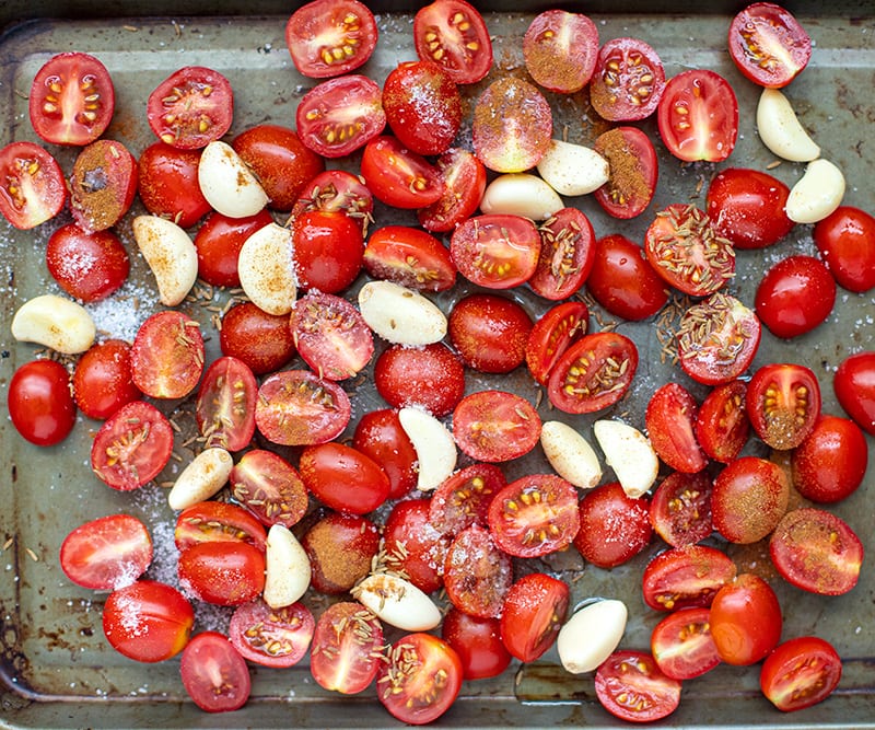 Roasting cherry tomatoes and garlic with spices
