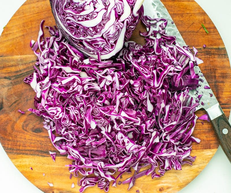 Shredded cabbage on a cutting board