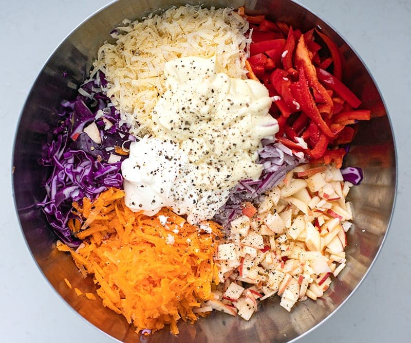 Making red cabbage slaw salad with creamy dressing