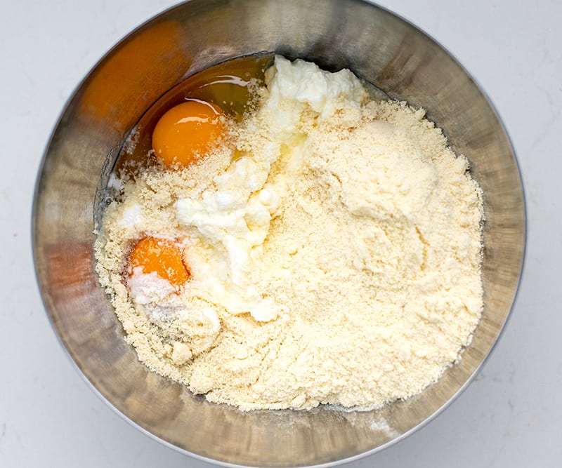 Ingredients for cottage cheese pancakes in a bowl