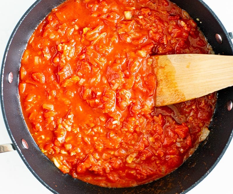 Add tomatoes and cook the sauce