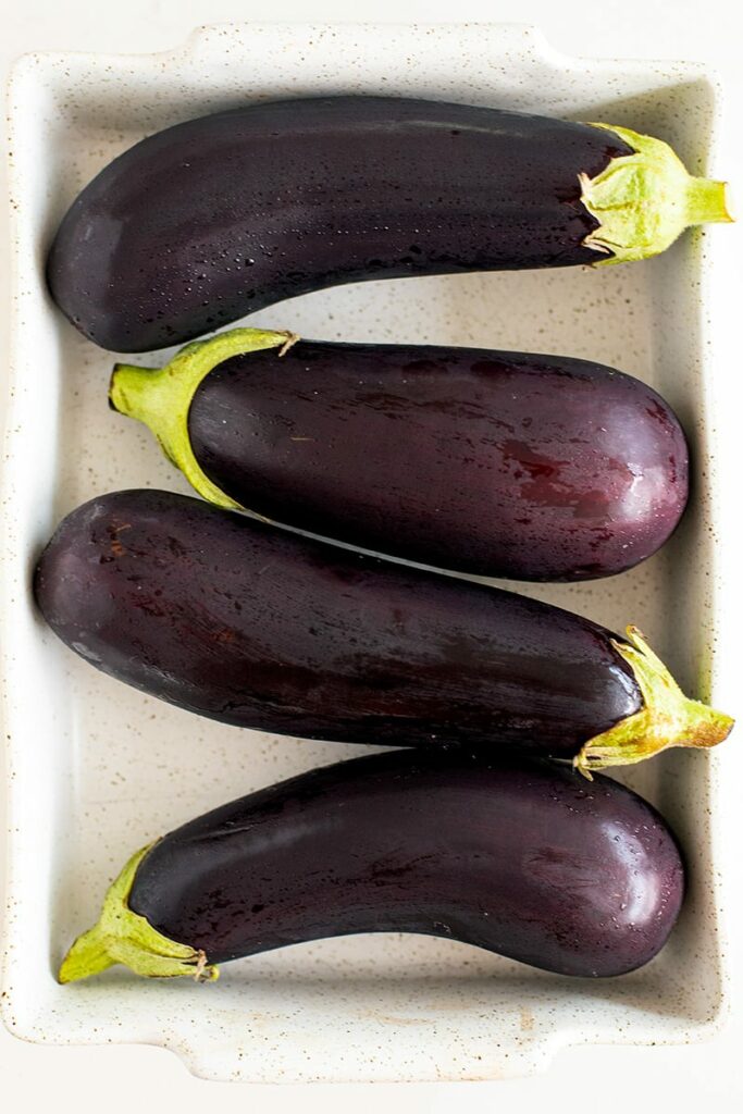 large eggplants in a dish
