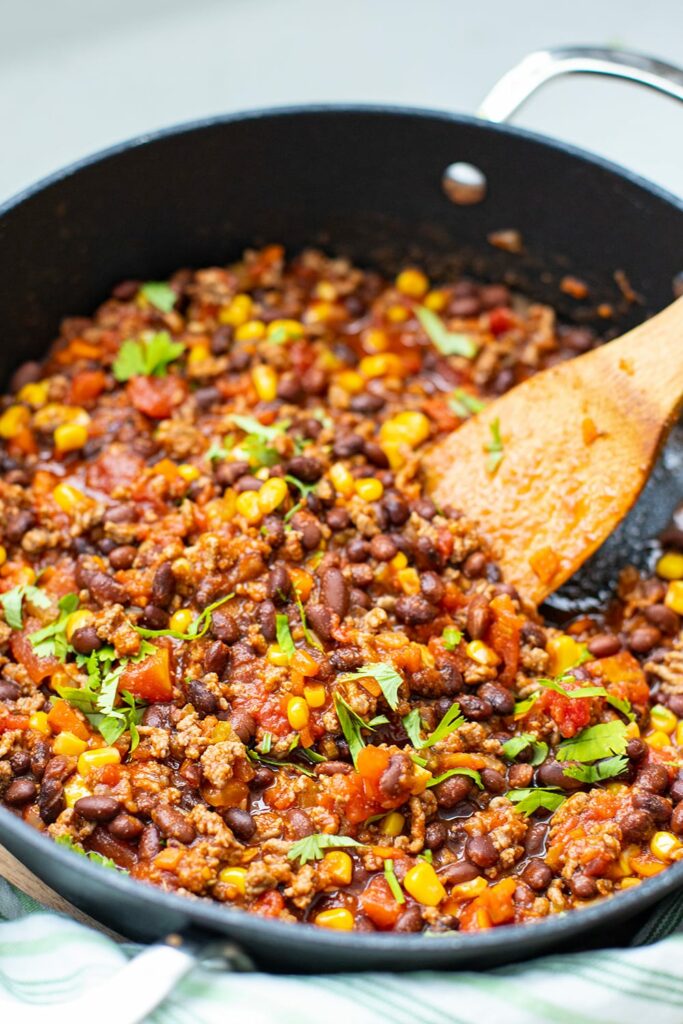 Mexican beef with beans and corn in a skillet