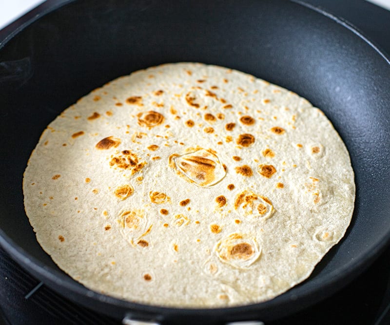 Toast tortilla wraps in a pan