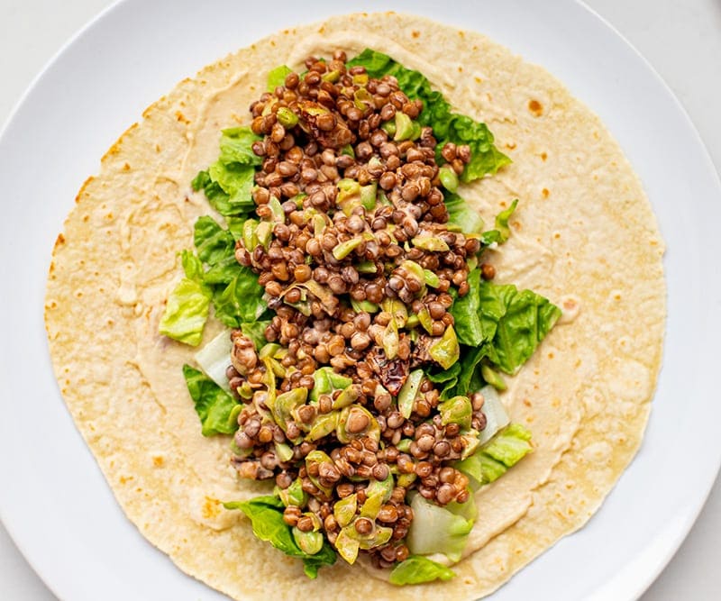 Lettuce and lentil mixture on a tortilla